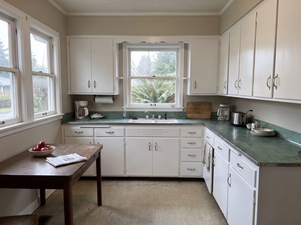 Same kitchen after the cabinets were sprayed